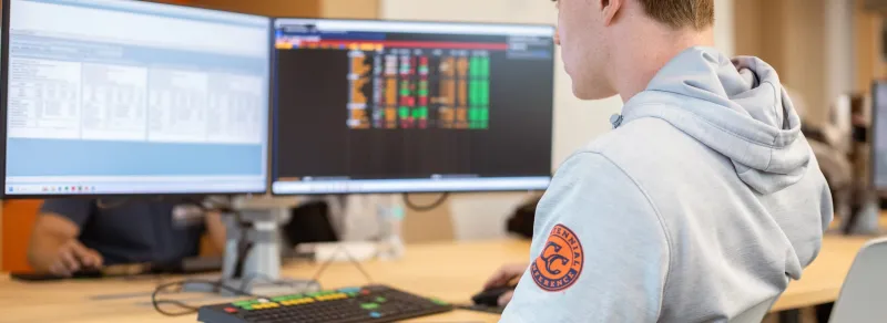 student at computer in Blooomberg terminal