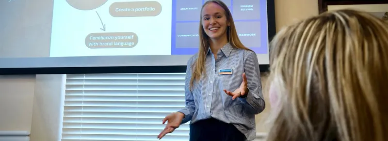 student speaks at front of class