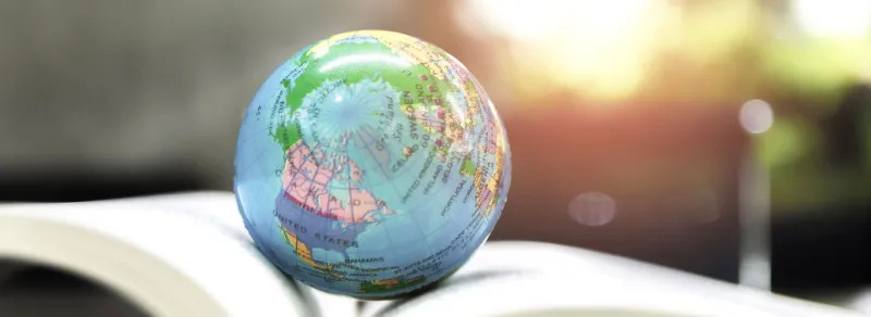 little globe on a book