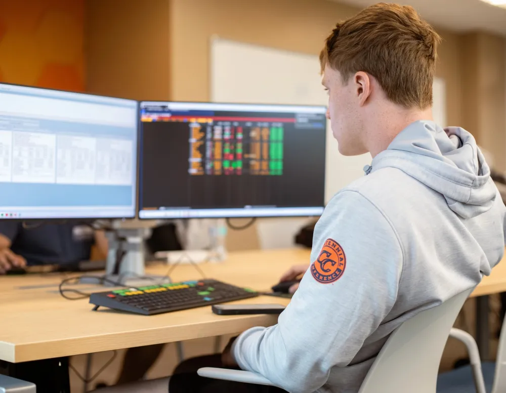 student at computer in Blooomberg terminal